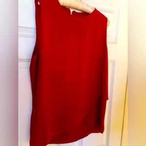 A red sleeveless Chicos top. Size 2 (10-12).